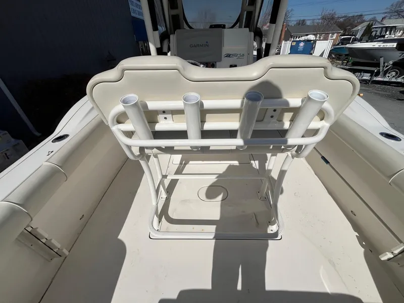 Slide: The Image of 2019 Key West 244 Center Console boat interior with rod holders and seating. - 13