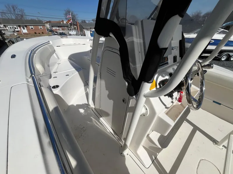 Slide: The Image of 2019 Key West 244 Center Console boat interior with steering wheel and seating area. - 17