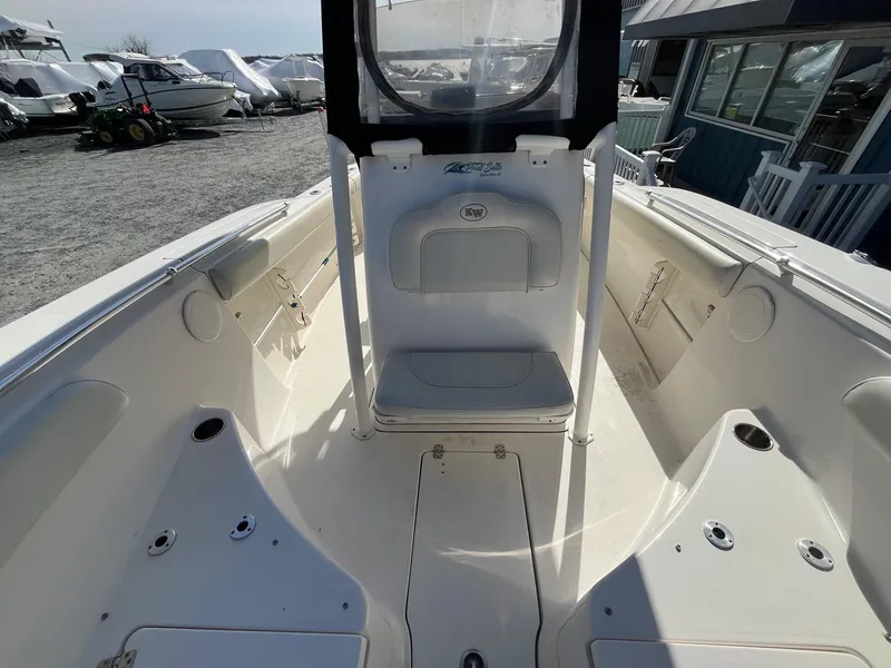 Slide: The Image of 2019 Key West 244 Center Console boat interior with seating and storage compartments. - 19