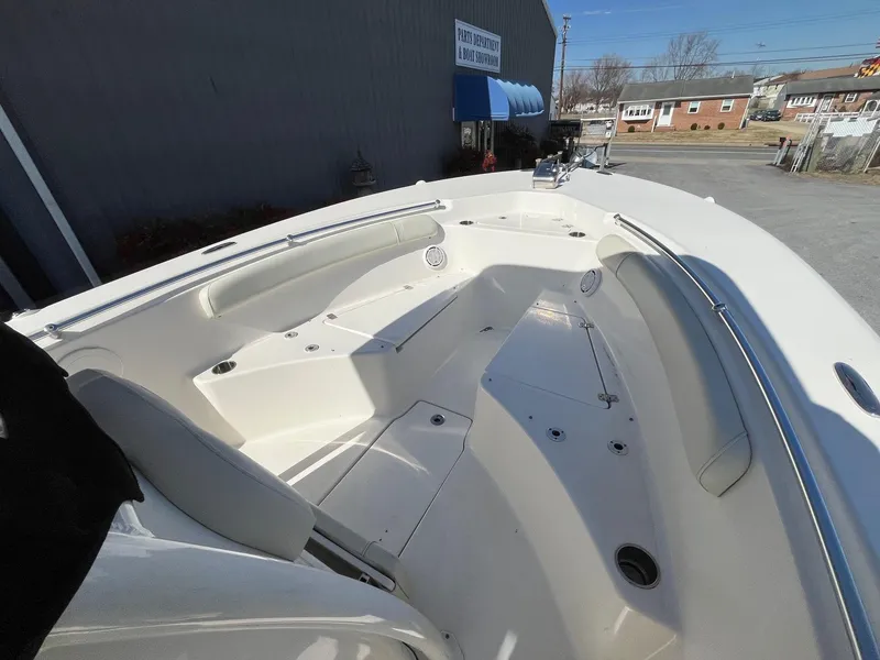 Slide: The Image of 2019 Key West 244 Center Console boat interior with seating and storage compartments. - 20