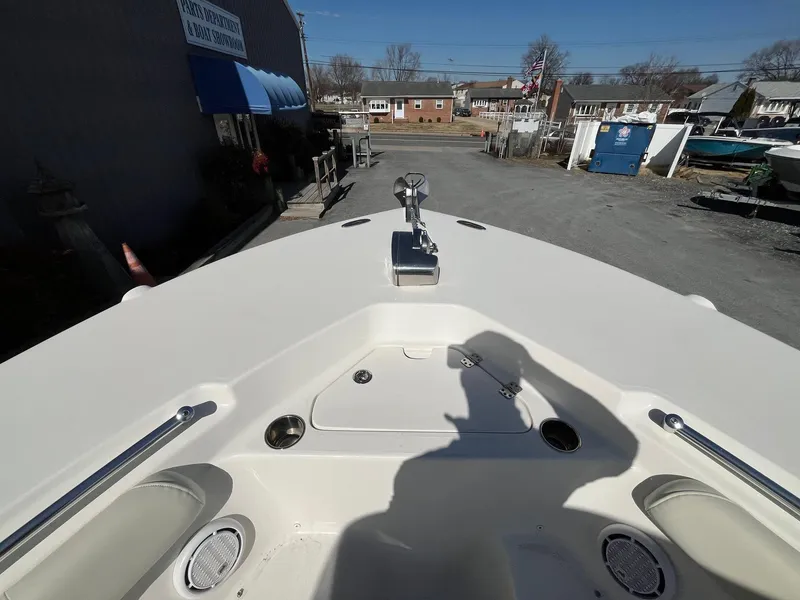 Slide: The Image of 2019 Key West 244 Center Console boat, bow view in a marina setting. - 22