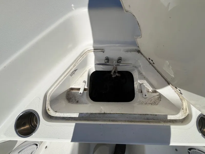 Slide: The Image of 2019 Key West 244 Center Console boat storage compartment with open hatch. - 23