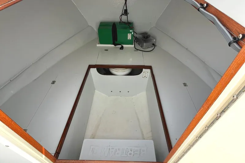 Slide: The Image of 1966 Bertram 31 boat interior with storage and equipment. - 17
