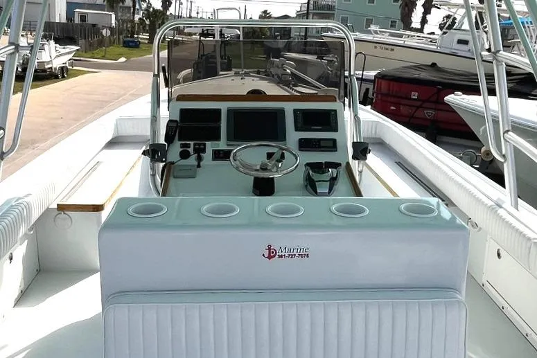 Slide: The Image of 1966 Bertram 31 boat cockpit with steering wheel and control panel. - 5