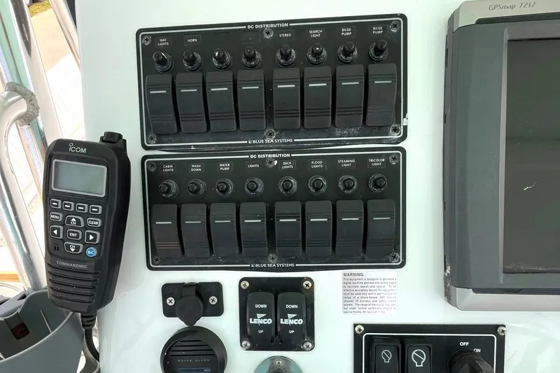 Slide: The Image of Control panel of a 1966 Bertram 31 boat with switches and communication device. - 7