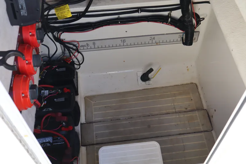 Slide: The Image of 2000 Hydra-Sports 2796 Vector boat battery compartment with wiring and measurement scale. - 14