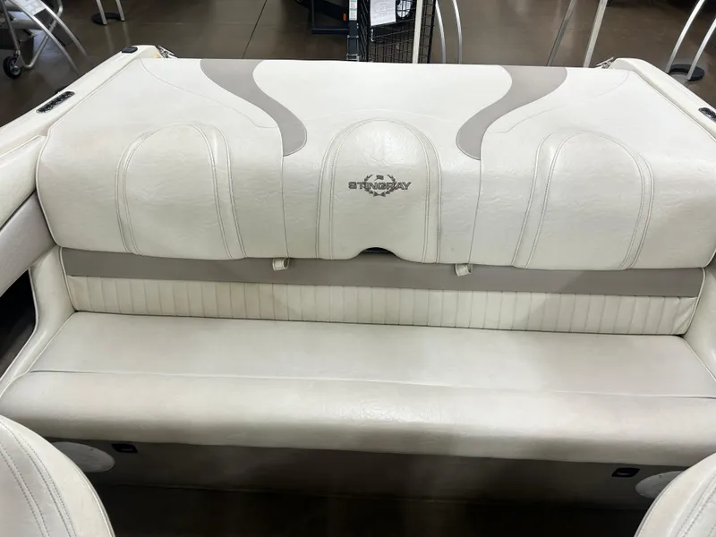 Slide: The Image of 2006 Stingray 205 Cuddy M/C boat interior with white leather seating. - 18
