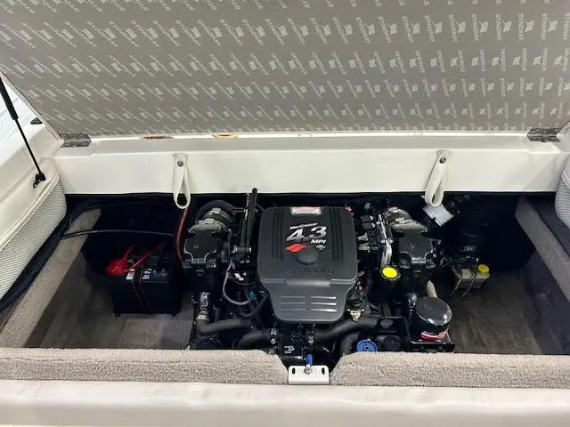 Slide: The Image of Engine compartment of a 2006 Stingray 200 CX Cuddy boat, featuring a MerCruiser 4.3 MPI engine. - 19