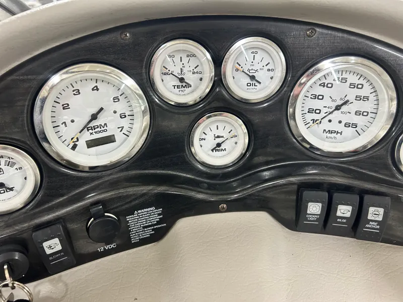 Slide: The Image of Dashboard of a 2006 Stingray 205 Cuddy M/C boat with gauges and controls. - 8