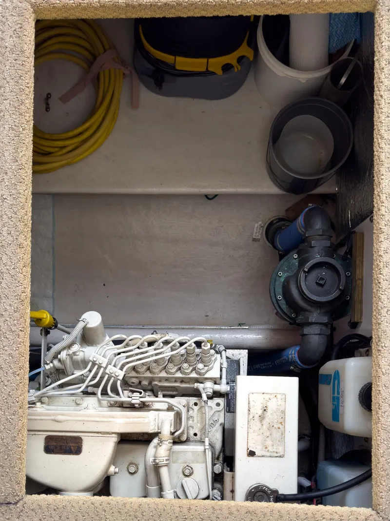 Slide: The Image of Engine compartment of a 2006 Nordic Tug 32' Plus with visible machinery and equipment. - 21