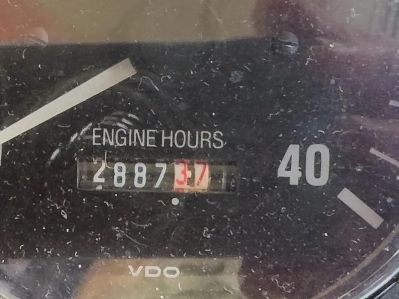 Slide: The Image of Engine hours gauge showing 2887.3 hours on a 2006 Nordic Tug 32' Plus. - 22