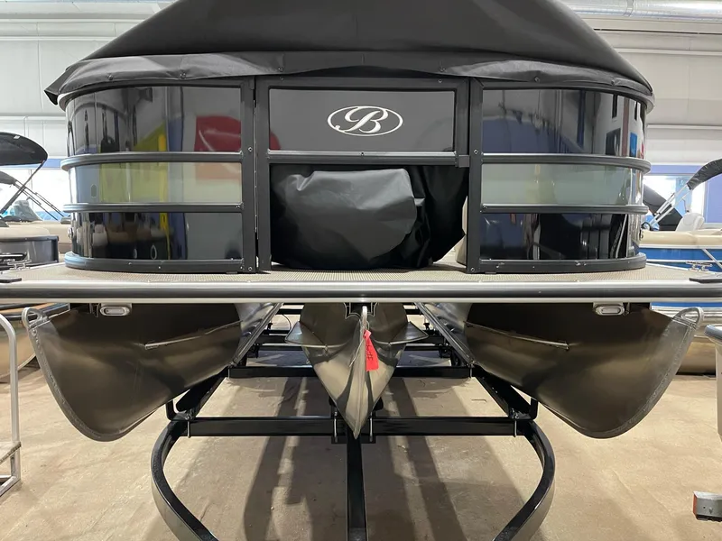 Slide: The Image of 2025 Bentley Pontoons 223 Fish pontoon boat, front view in showroom. - 0