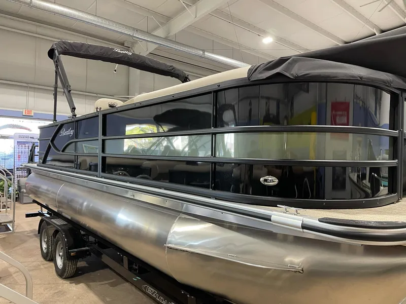 Slide: The Image of 2025 Bentley Pontoons 223 Fish pontoon boat displayed indoors. - 1
