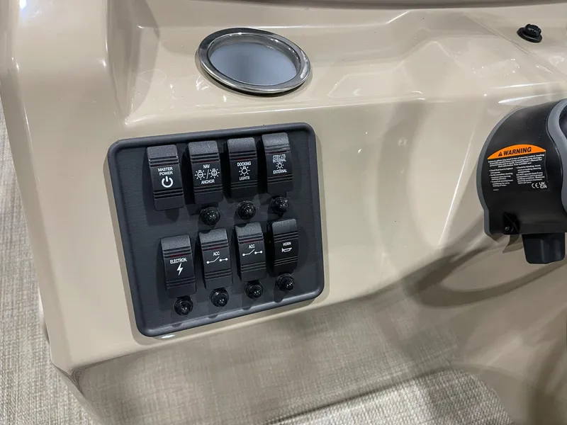 Slide: The Image of Control panel of 2025 Bentley Pontoons 223 Fish boat with switches and cup holder. - 12