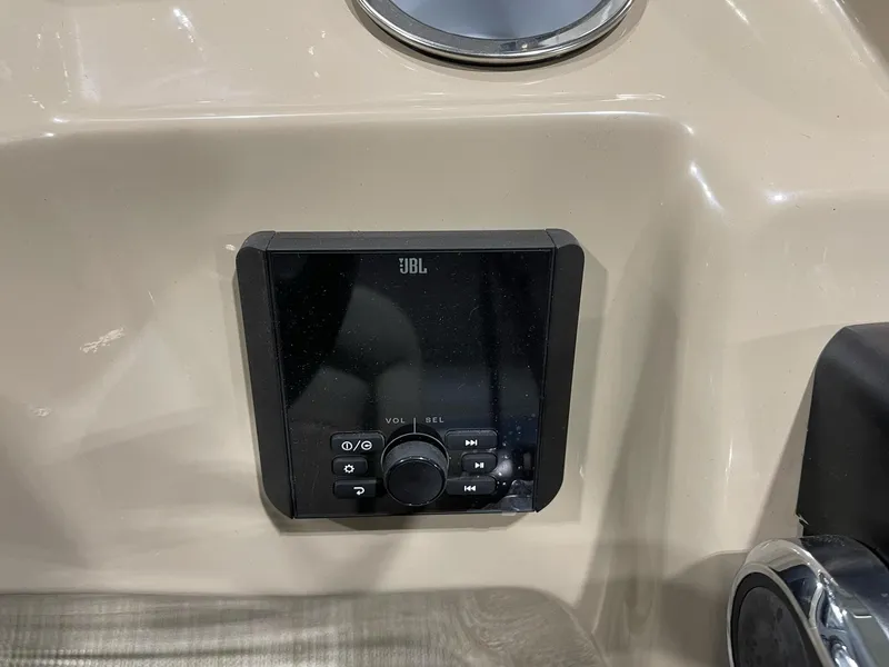 Slide: The Image of JBL audio control panel on 2025 Bentley Pontoons 223 Fish dashboard. - 13