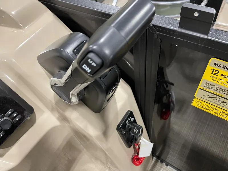 Slide: The Image of Control panel of 2025 Bentley Pontoons 223 Fish boat with throttle lever. - 14
