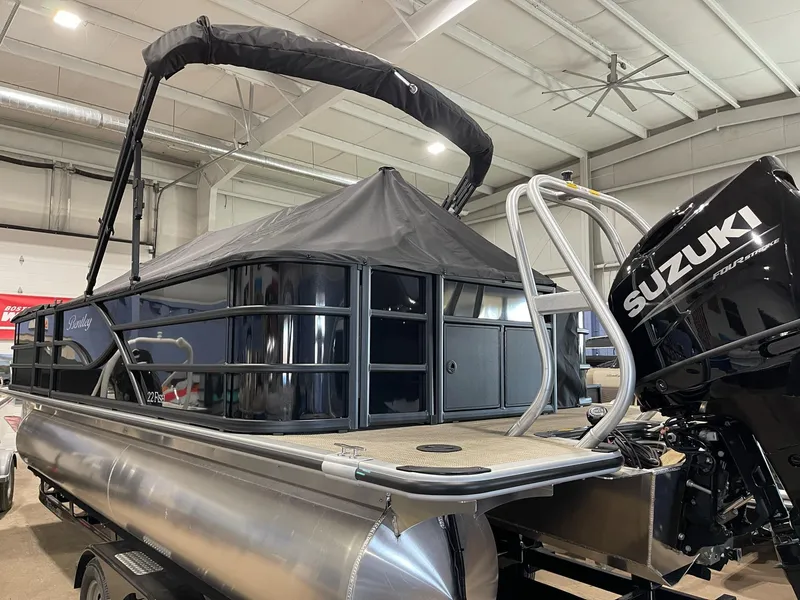 Slide: The Image of 2025 Bentley Pontoons 223 Fish with Suzuki engine in showroom. - 4