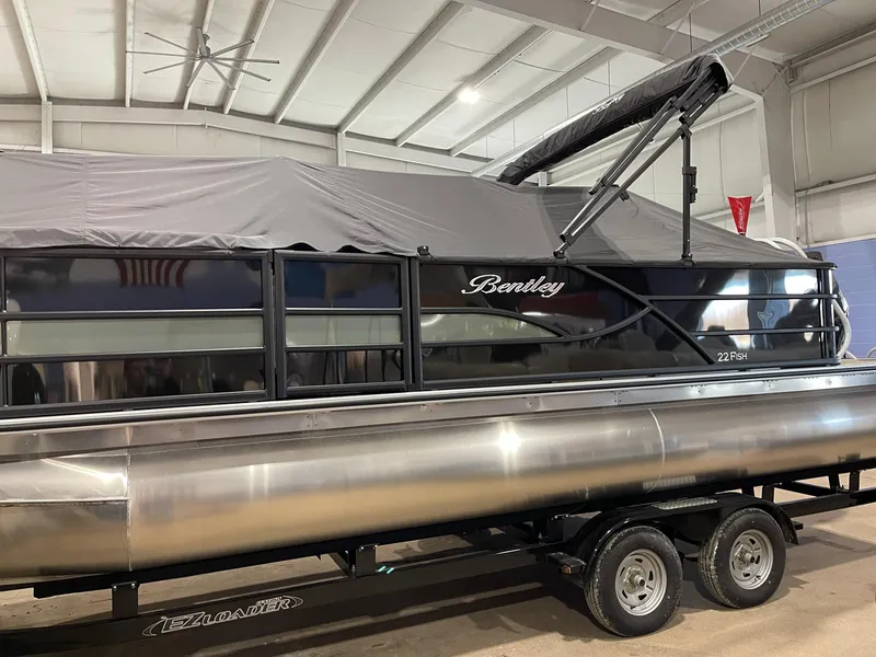 Slide: The Image of 2025 Bentley Pontoons 223 Fish boat in indoor storage, covered and on a trailer. - 5