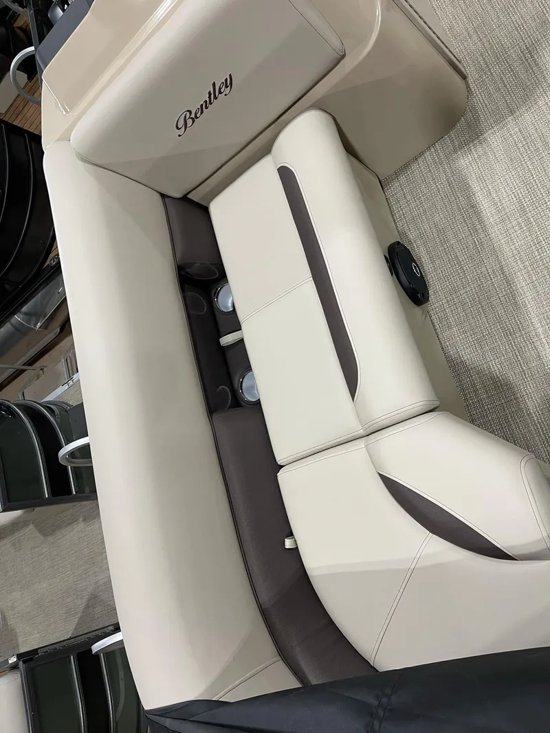 Slide: The Image of 2025 Bentley Pontoons 223 Fish interior seating with beige and brown upholstery. - 8