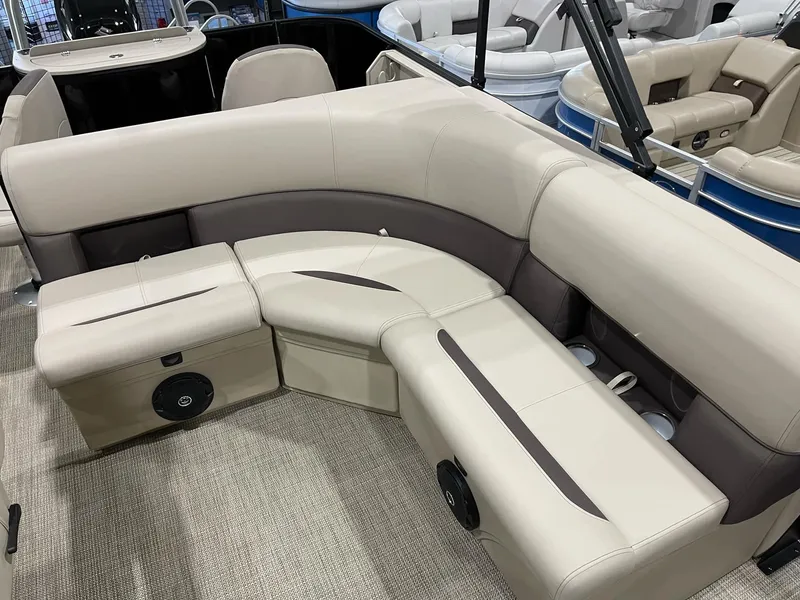 Slide: The Image of 2025 Bentley Pontoons 223 Fish interior seating with beige and brown upholstery. - 9