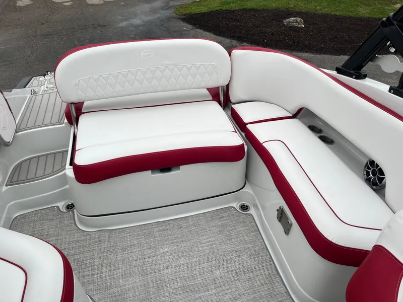 Slide: The Image of 2023 Crownline 260 SS boat interior with white and red seating, featuring diamond-patterned upholstery. - 11