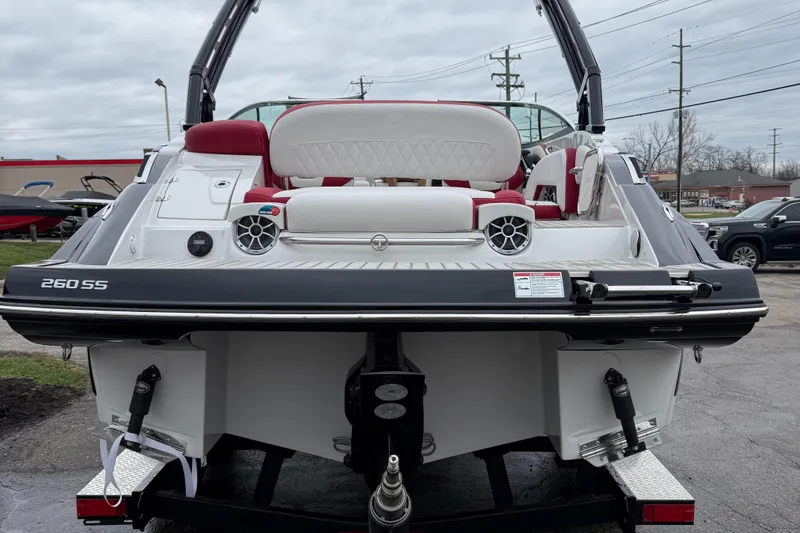 Slide: The Image of 2023 Crownline 260 SS boat, rear view, showcasing seating and speakers. - 13
