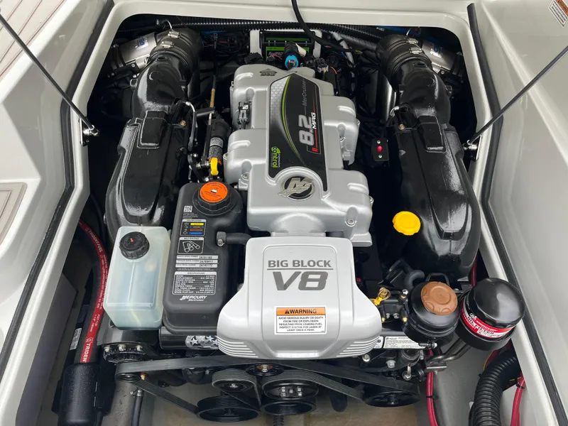 Slide: The Image of 2023 Crownline 260 SS engine compartment with Big Block V8, showcasing powerful marine performance. - 14