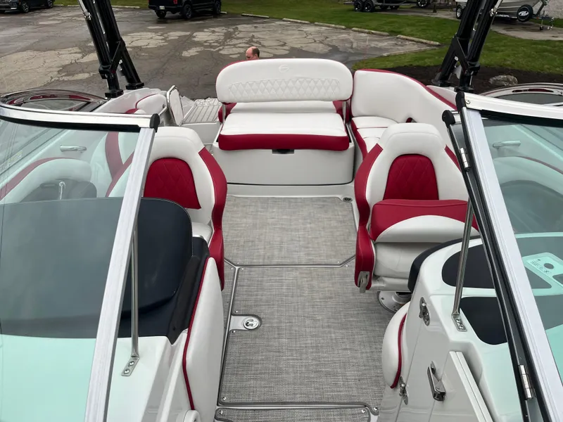 Slide: The Image of 2023 Crownline 260 SS boat interior with red and white seating, spacious layout. - 5