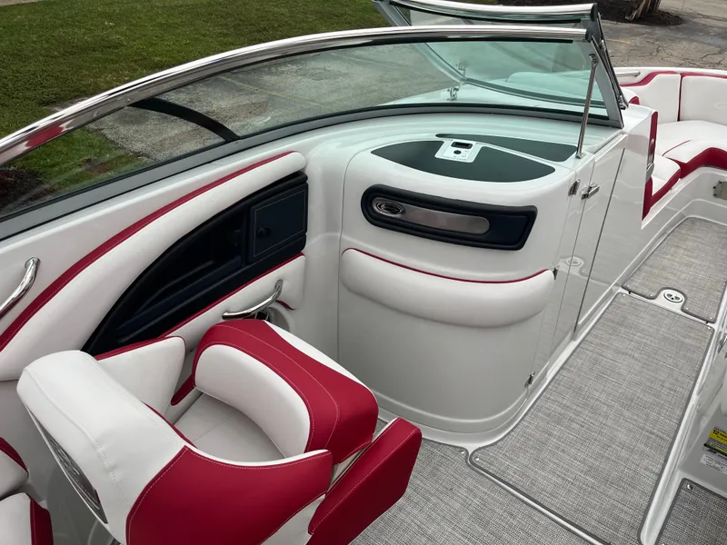 Slide: The Image of 2023 Crownline 260 SS boat interior with red and white seating, sleek design. - 9