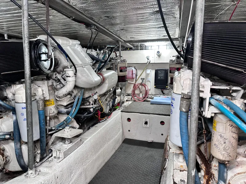 Slide: The Image of Electrical panel of a 1990 Ocean Yachts 48 Super Sport boat, featuring switches and gauges. - 25