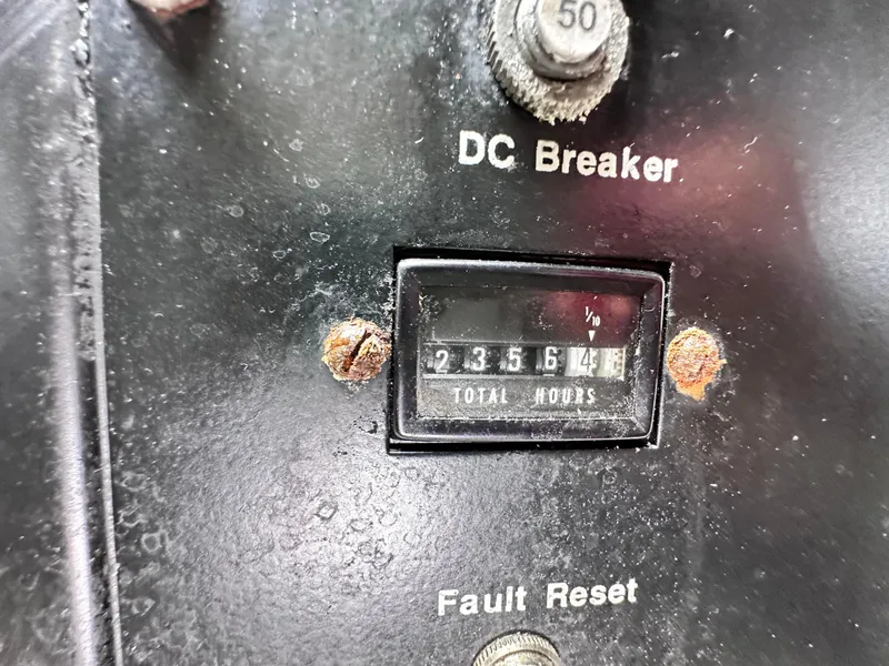 Slide: The Image of Engine room of a 1990 Ocean Yachts 48 Super Sport, showcasing mechanical components and equipment. - 26