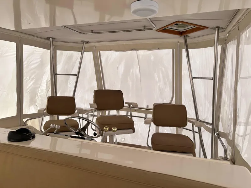 Slide: The Image of Interior view of 1990 Ocean Yachts 48 Super Sport helm with seating and controls. - 11