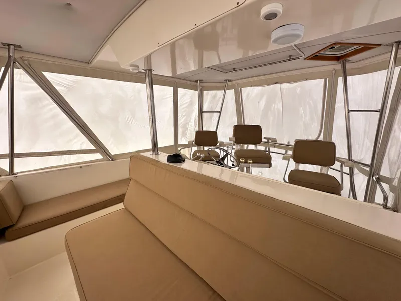 Slide: The Image of Interior of 1990 Ocean Yachts 48 Super Sport with helm and seating area. - 12