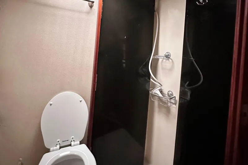 Slide: The Image of 1990 Ocean Yachts 48 Super Sport yacht kitchen with wood cabinetry and modern appliances. - 22