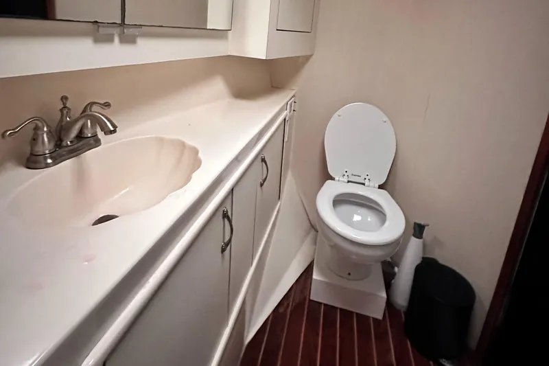 Slide: The Image of Bathroom interior of 1990 Ocean Yachts 48 Super Sport with shower and toilet. - 23