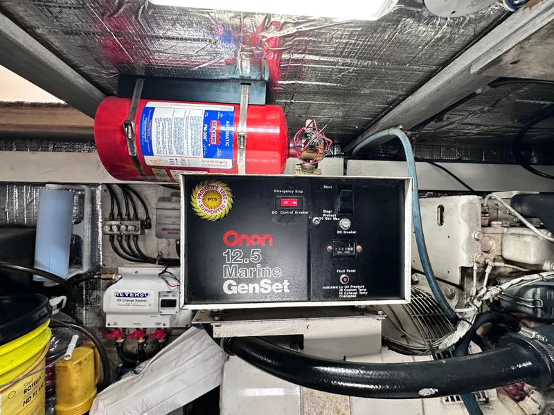 Slide: The Image of Engine room of a 1990 Ocean Yachts 48 Super Sport with Onan generator. - 30