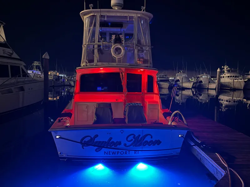 Slide: The Image of 1990 Ocean Yachts 48 Super Sport cruising on open water. - 4