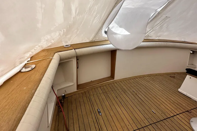 Slide: The Image of 1990 Ocean Yachts 48 Super Sport docked, named "Saylor Moon," in Newport, RI marina. - 7