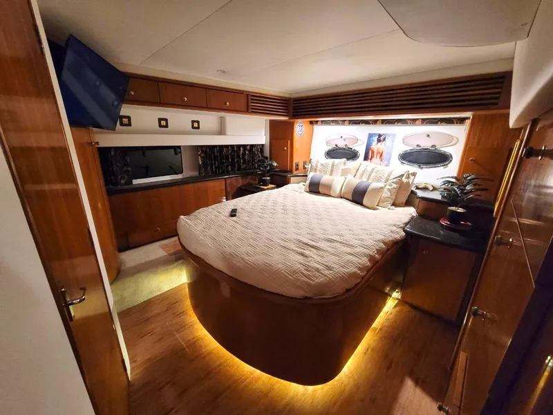 Slide: The Image of Luxurious bedroom interior of 2001 Carver 396 Motor Yacht with ambient lighting. - 19