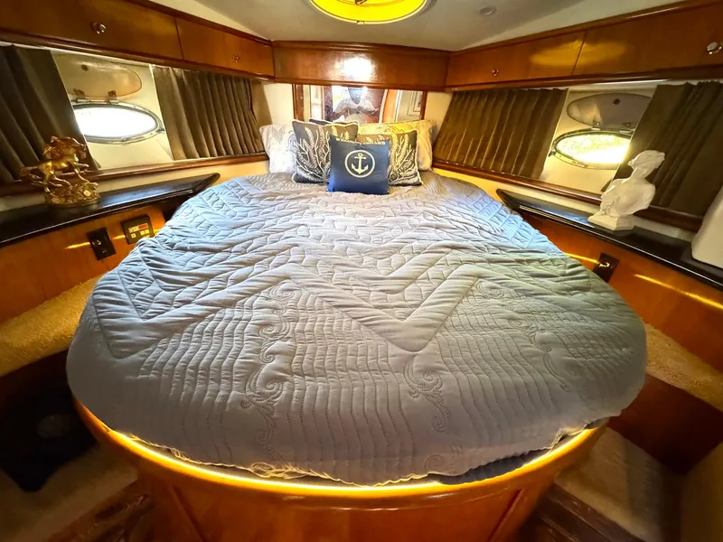 Slide: The Image of Luxurious bedroom interior of 2001 Carver 396 Motor Yacht with elegant bedding and decor. - 23