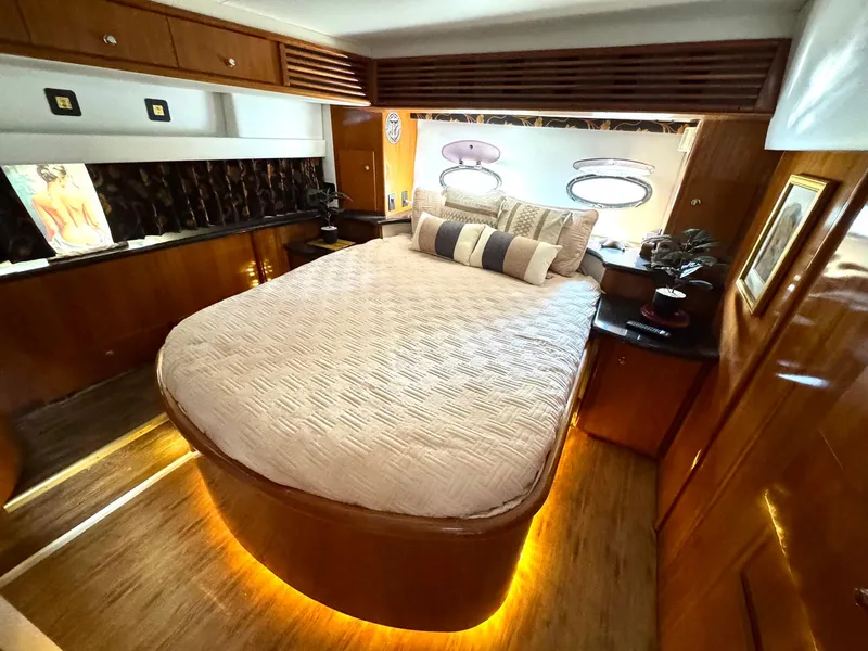 Slide: The Image of Luxurious bedroom interior of 2001 Carver 396 Motor Yacht with elegant wood finishes. - 24