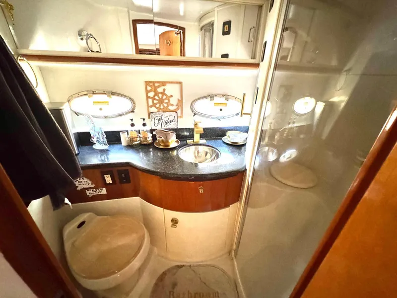 Slide: The Image of Bathroom interior of 2001 Carver 396 Motor Yacht with modern amenities. - 25