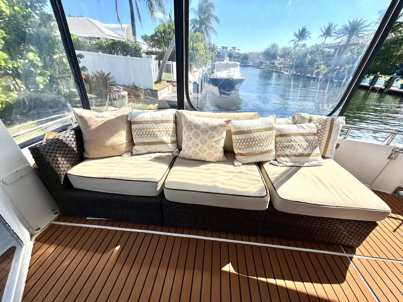 Slide: The Image of Luxurious seating on 2001 Carver 396 Motor Yacht with waterfront view. - 31