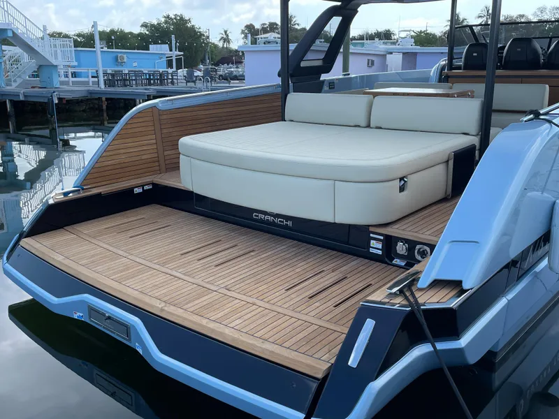 Slide: The Image of 2023 Cranchi A46 yacht with spacious deck and luxurious seating. - 17
