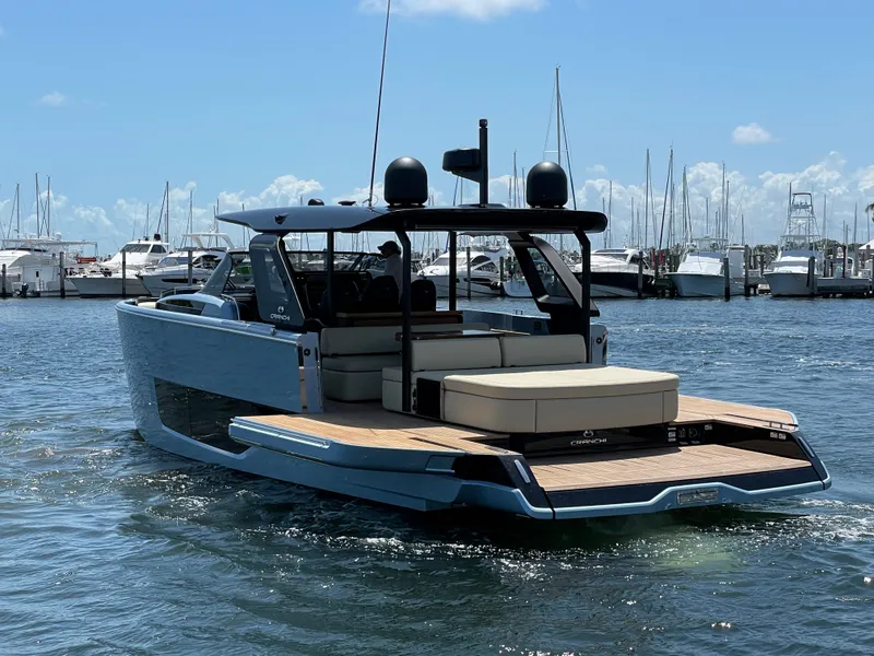 Slide: The Image of 2023 Cranchi A46 yacht on water, featuring sleek design and spacious deck. - 34