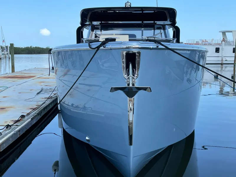 Slide: The Image of 2023 Cranchi A46 yacht docked at marina, front view. - 7