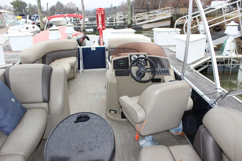 Slide: The Image of 2023 Sylvan Mirage 820 LZ pontoon boat interior with seating and steering console. - 21