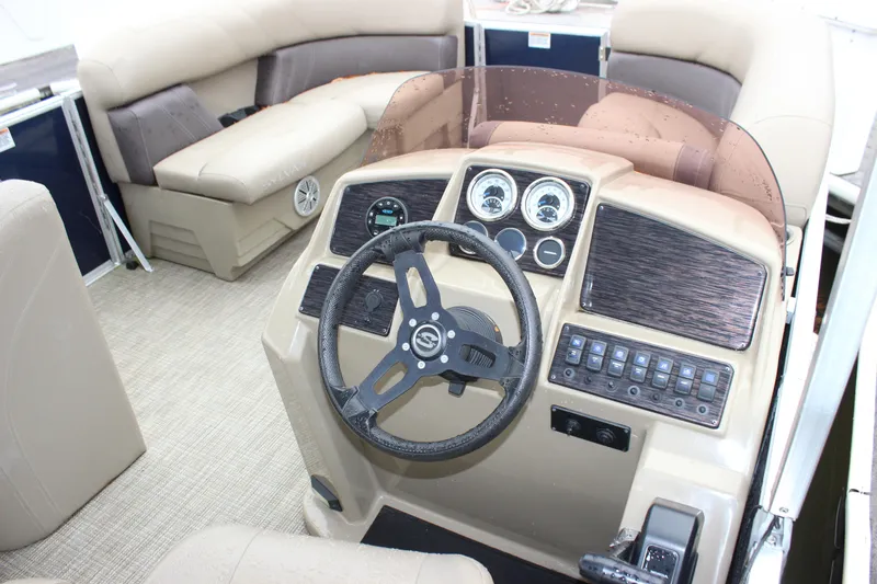 Slide: The Image of 2023 Sylvan Mirage 820 LZ boat interior with steering wheel and dashboard controls. - 6