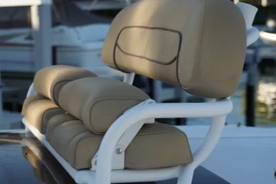 Slide: The Image of 2017 Sportsman Masters 267 Bay Boat, beige cushioned seating detail. - 15