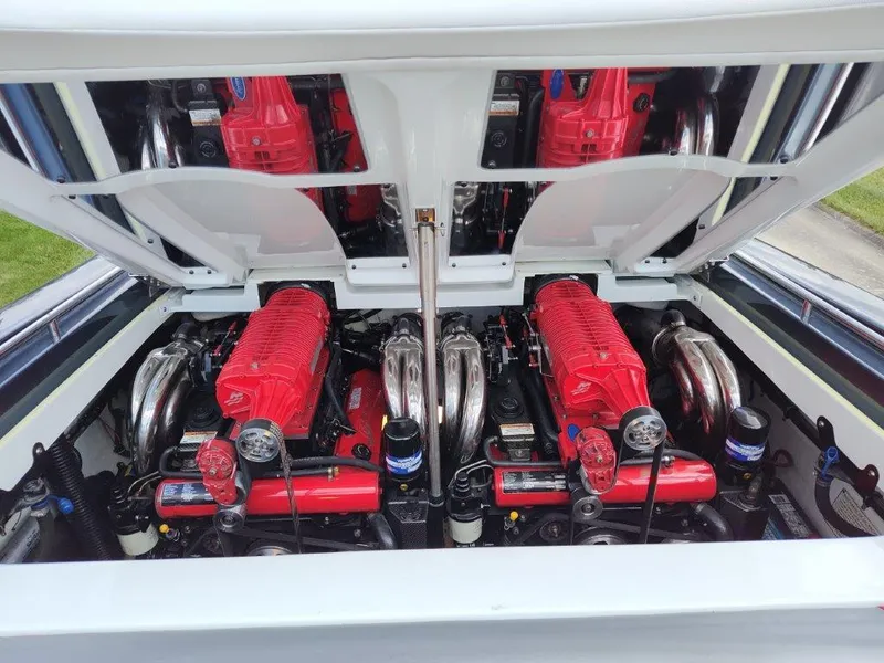 Slide: The Image of 2015 Formula 382 FASTech engine compartment with dual red engines and chrome components. - 12